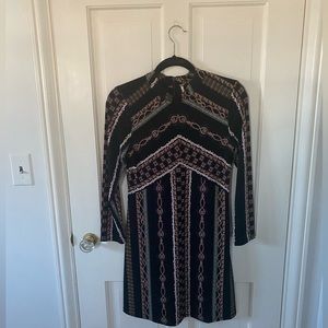 Free people long sleeve dress. Black patterned. size small
